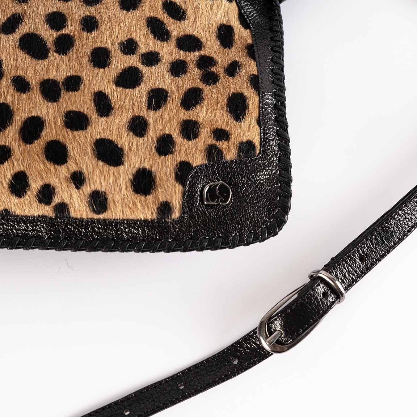 Maduva : Ladies Leather Crossbody Handbag in Spotted print & Black